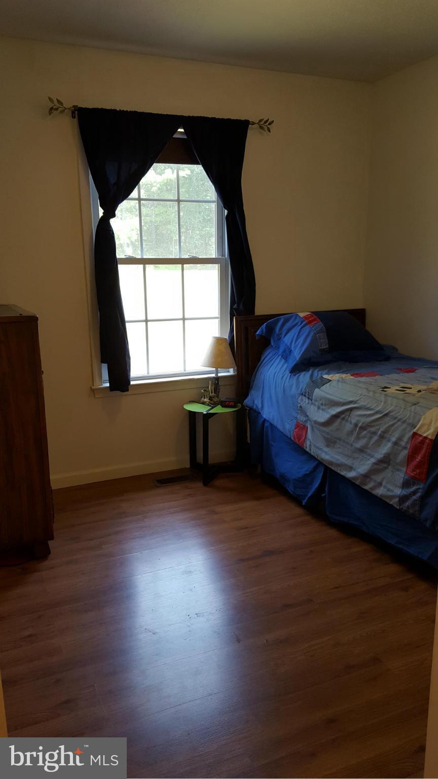 4258 Timber Ridge Road Berkeley Springs, WV 25411 - Photo 14 of 26 a room with a bed and a window