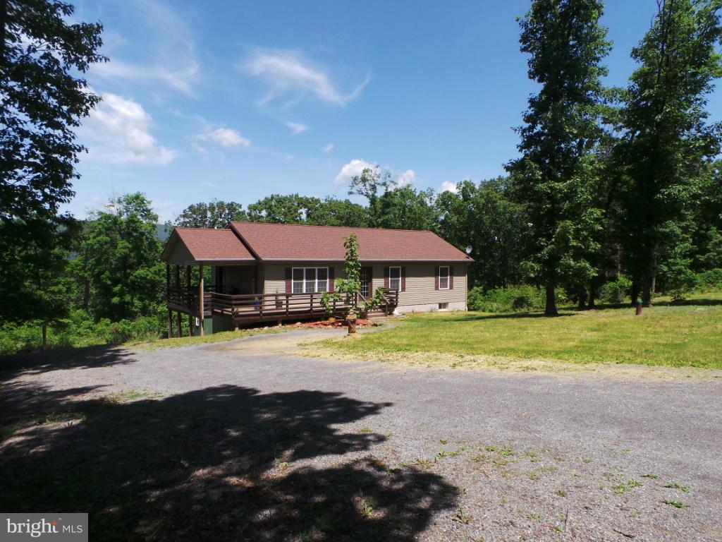 4258 Timber Ridge Road Berkeley Springs, WV 25411 - Photo 22 of 26 a front view of a house with a big yard