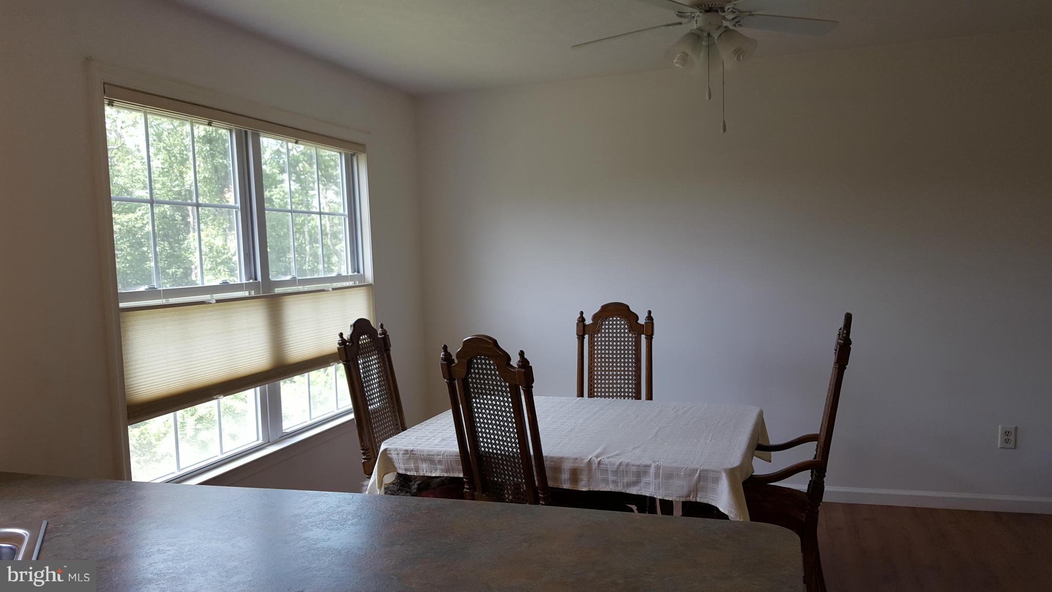 4258 Timber Ridge Road Berkeley Springs, WV 25411 - Photo 5 of 26 a view of a workspace with furniture and a window