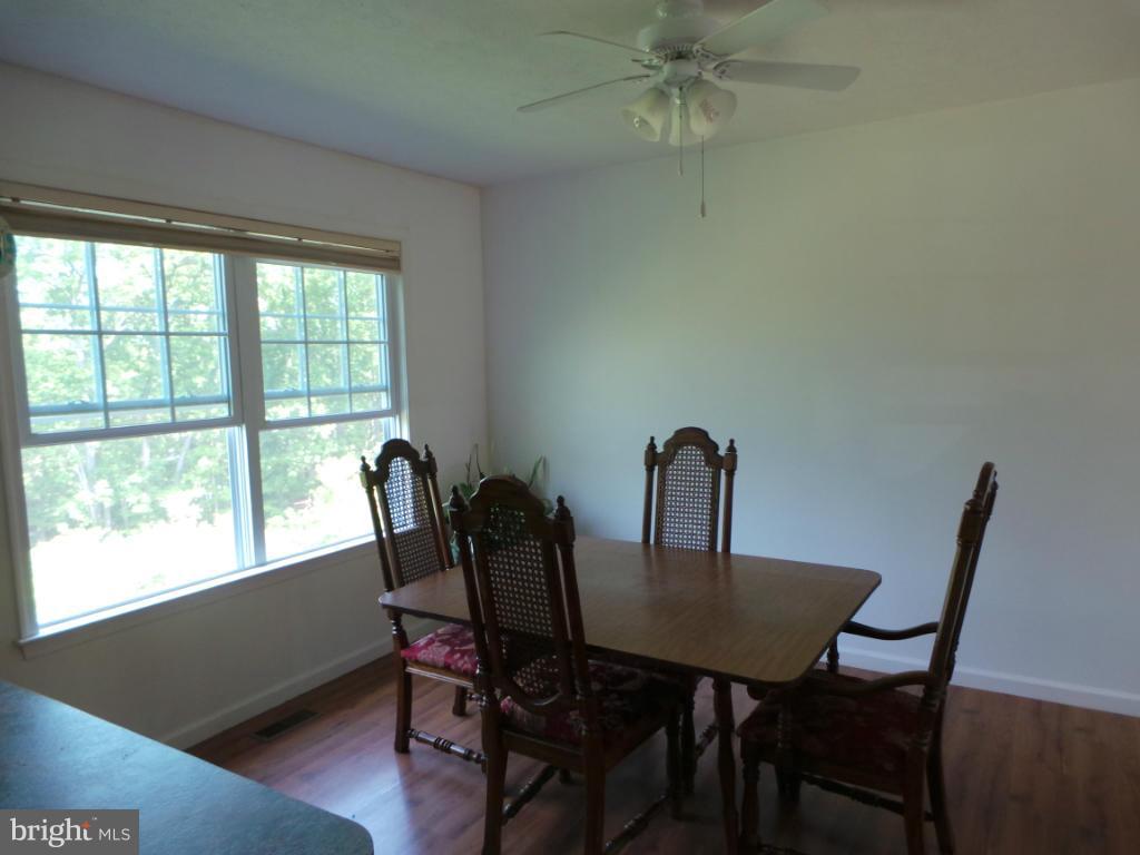 4258 Timber Ridge Road Berkeley Springs, WV 25411 - Photo 6 of 26 a view of a dining room with furniture and window