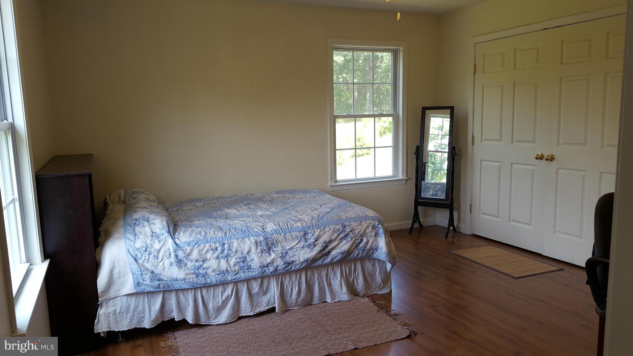 4258 Timber Ridge Road Berkeley Springs, WV 25411 - Photo 9 of 26 a bedroom with a bed and a window
