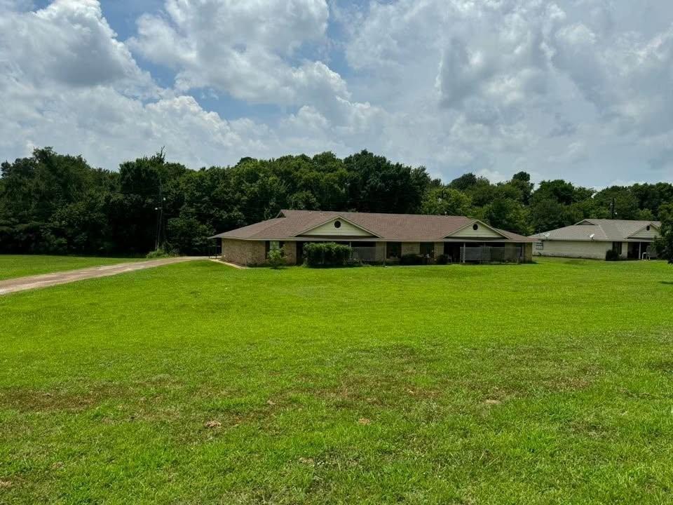 4515 Southeast Loop 286 Paris, TX 75460 - Photo 31 of 37 a view of yard with swimming pool and green space