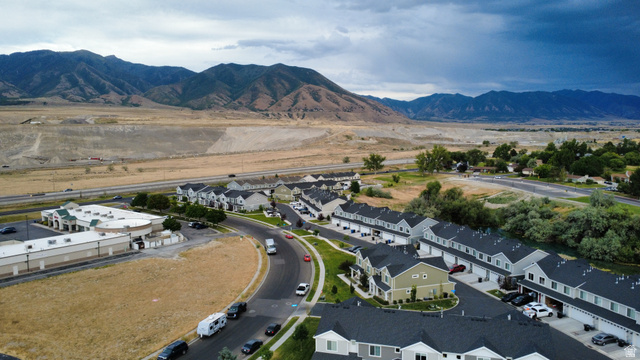562 Hal Street, Unit 152 Tooele, UT 84074 - Photo 40 of 44 Residential development featuring multi-story townhomes and single-family residences with dark shingle roofs