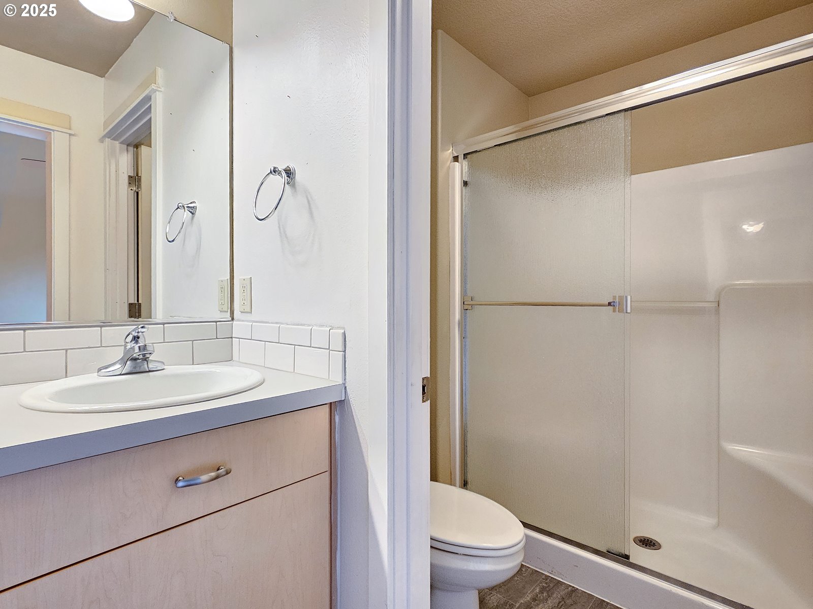 15621 Southeast Eckert Lane Damascus, OR 97089 - Photo 19 of 24 a bathroom with a granite countertop sink toilet and shower