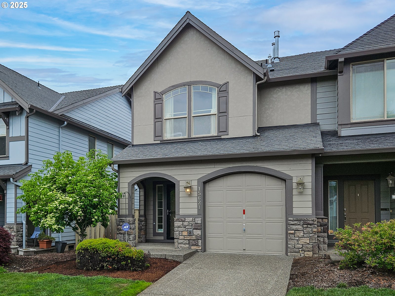 15621 Southeast Eckert Lane Damascus, OR 97089 - Photo 2 of 24 a front view of a house with a yard