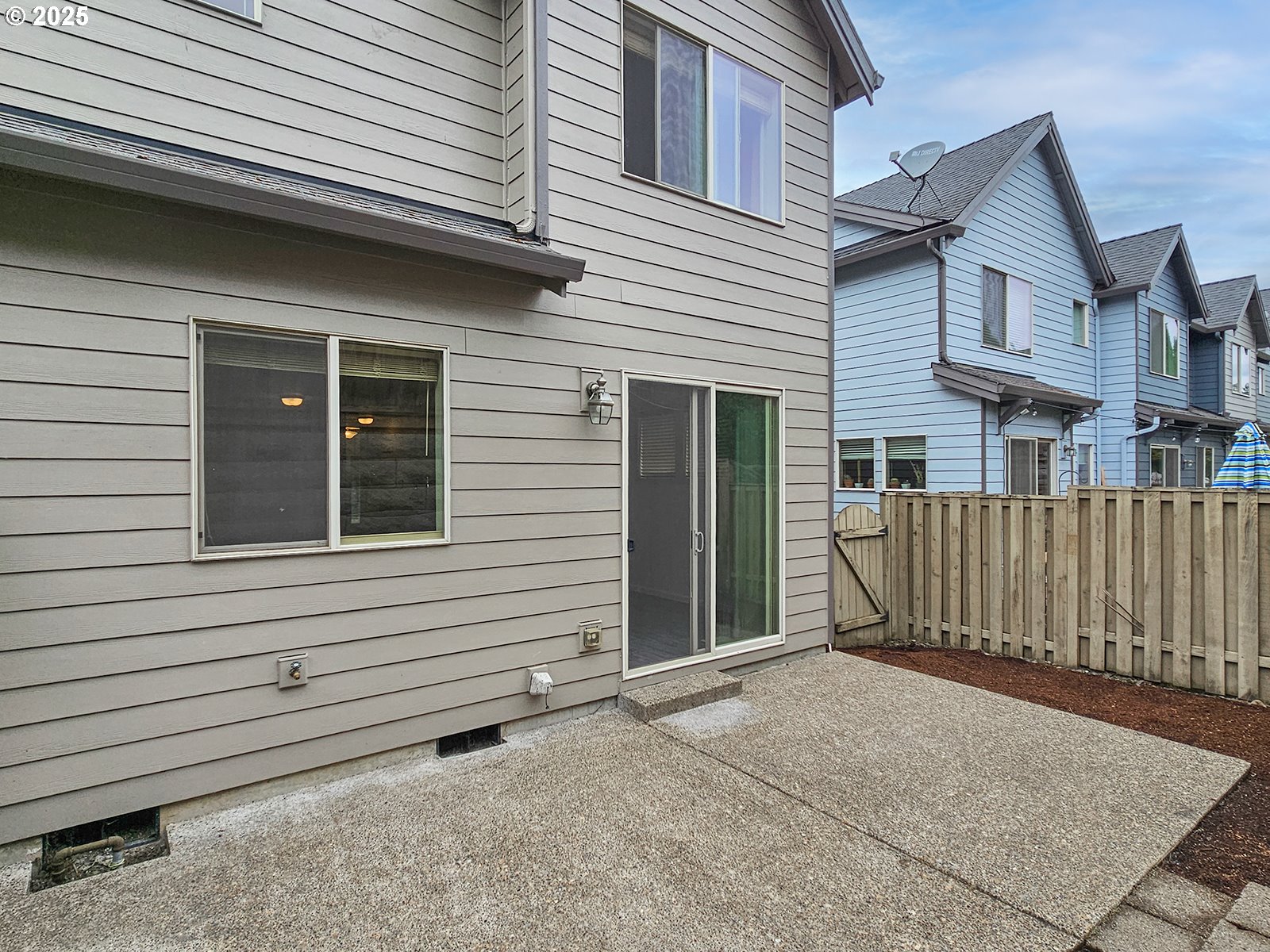 15621 Southeast Eckert Lane Damascus, OR 97089 - Photo 24 of 24 a view of a house with a small space and wooden fence