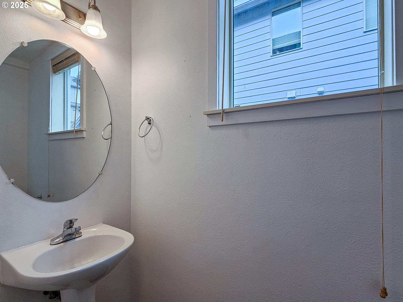 15621 Southeast Eckert Lane Damascus, OR 97089 - Photo 4 of 24 a bathroom with a sink and a mirror