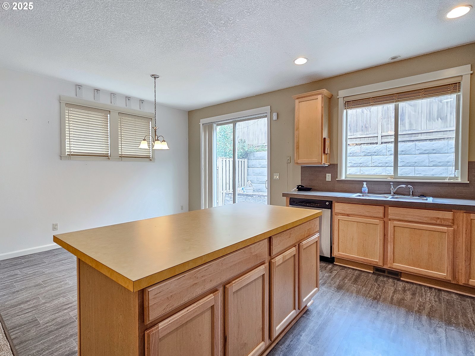 15621 Southeast Eckert Lane Damascus, OR 97089 - Photo 9 of 24 a kitchen with sink cabinets and wooden floor