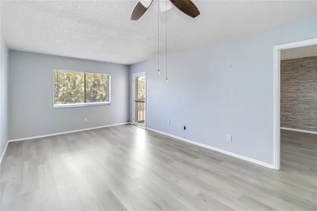 a view of an empty room and a window