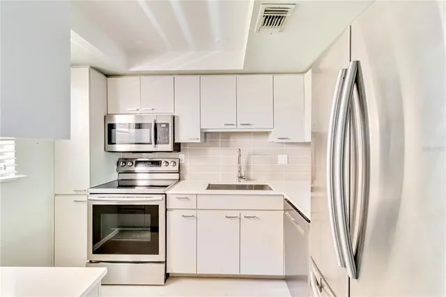 a bathroom with a sink mirror toilet and bathtub