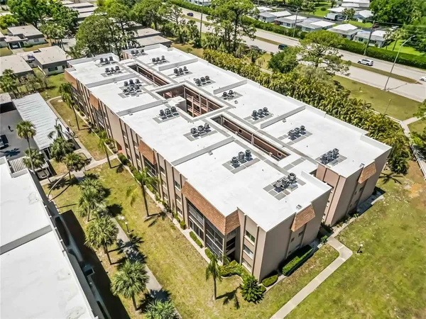 an aerial view of a house with a swimming pool