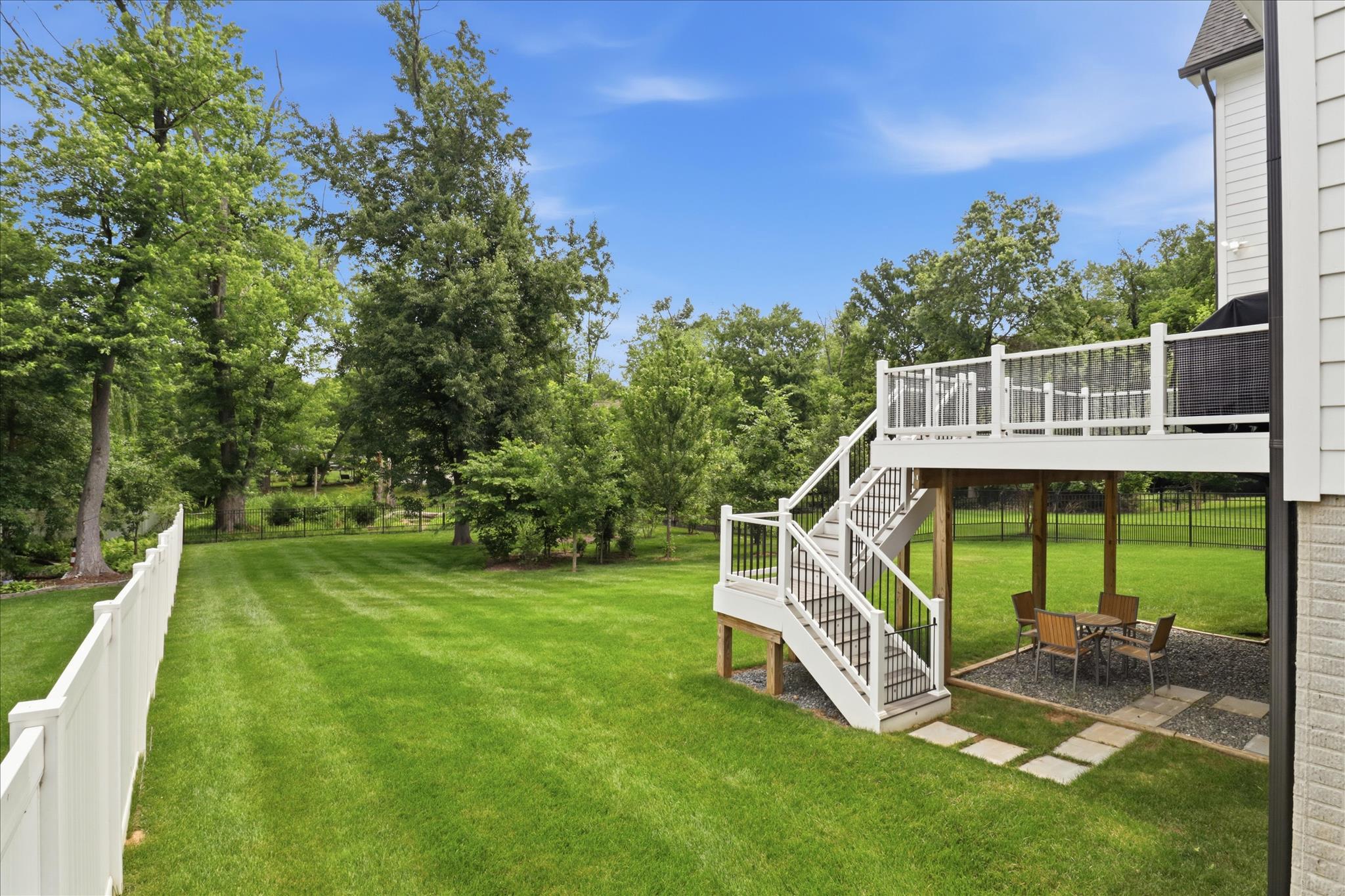 202 Branch Road Southeast Vienna, VA 22180 - Photo 2 of 59 a view of a deck with a big yard and potted plants