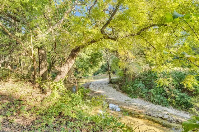 a view of a swimming pool with a balcony