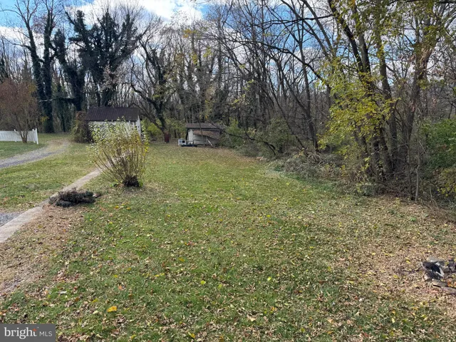 a view of outdoor space with deck and yard