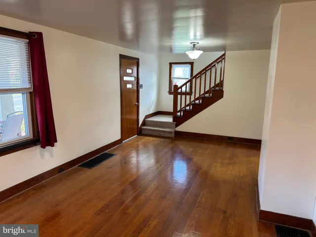 a view of an entryway with wooden floor