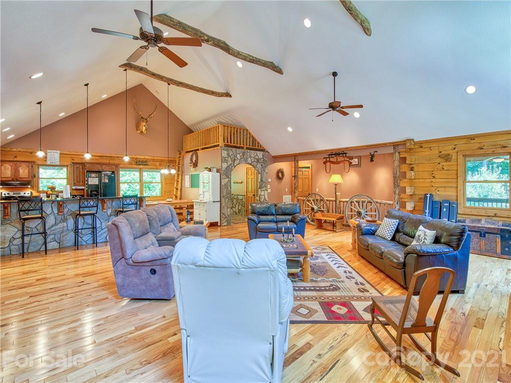273 Mellow Springs Road Waynesville, NC 28786 - Photo 11 of 40 a living room with lots of furniture and a large window