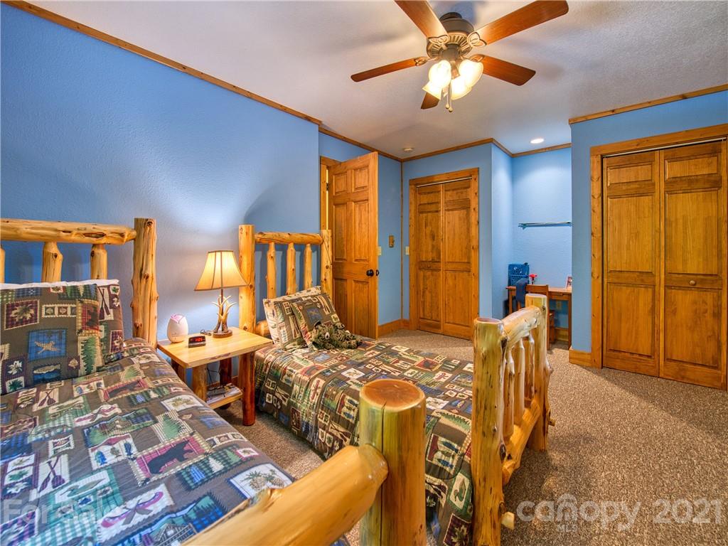 273 Mellow Springs Road Waynesville, NC 28786 - Photo 21 of 40 a bedroom with furniture and a window