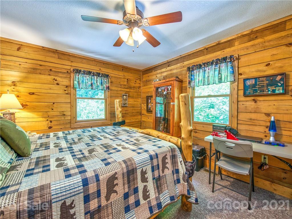 273 Mellow Springs Road Waynesville, NC 28786 - Photo 24 of 40 a bedroom with a bed and a window