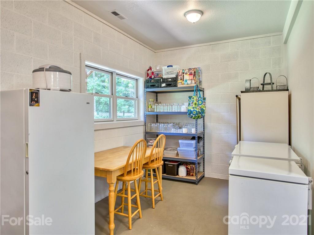 273 Mellow Springs Road Waynesville, NC 28786 - Photo 33 of 40 a workspace with furniture and a window