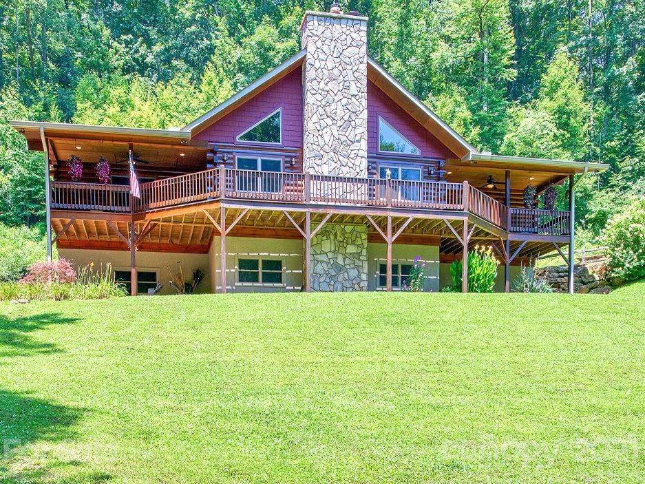 273 Mellow Springs Road Waynesville, NC 28786 - Photo 40 of 40 a view of house with backyard and outdoor seating