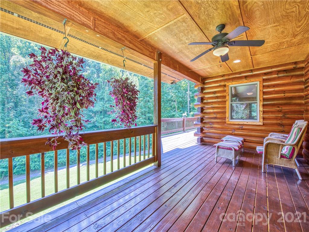 273 Mellow Springs Road Waynesville, NC 28786 - Photo 7 of 40 a view of a two chairs in the balcony