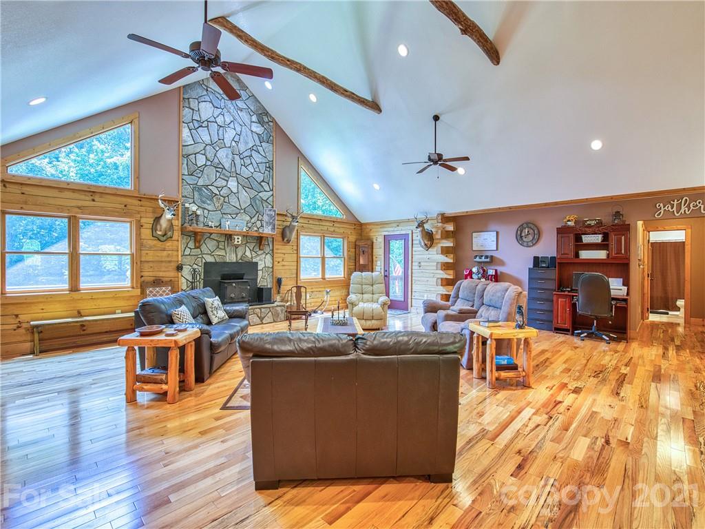 273 Mellow Springs Road Waynesville, NC 28786 - Photo 8 of 40 a living room with lots of furniture and kitchen view
