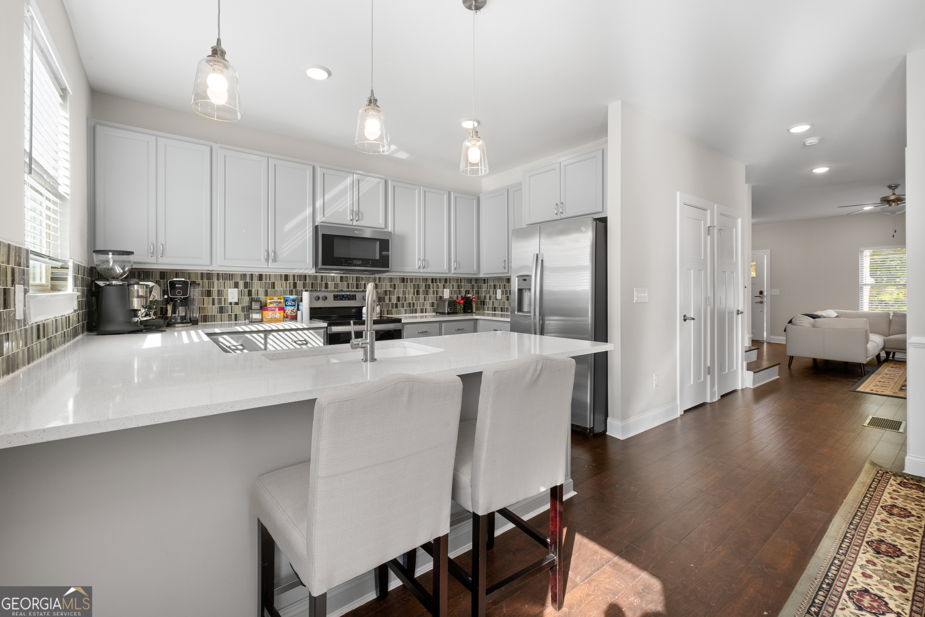 3775 Jack Vernon Circle Powder Springs, GA 30127 - Photo 12 of 33 a kitchen with refrigerator and chairs