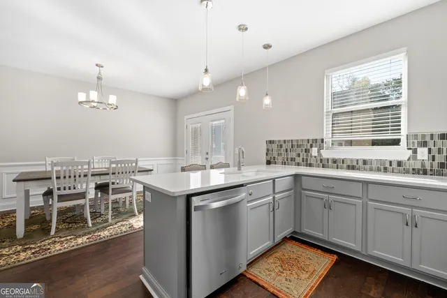 a kitchen with lots of counter top space and sink