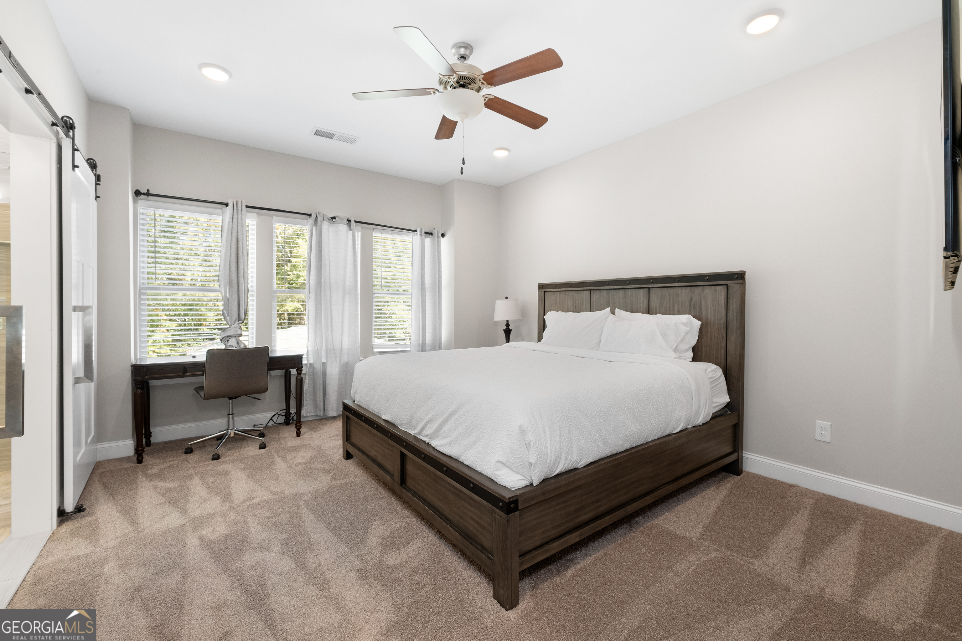 3775 Jack Vernon Circle Powder Springs, GA 30127 - Photo 16 of 33 a bed sitting in a spacious bedroom next to a window