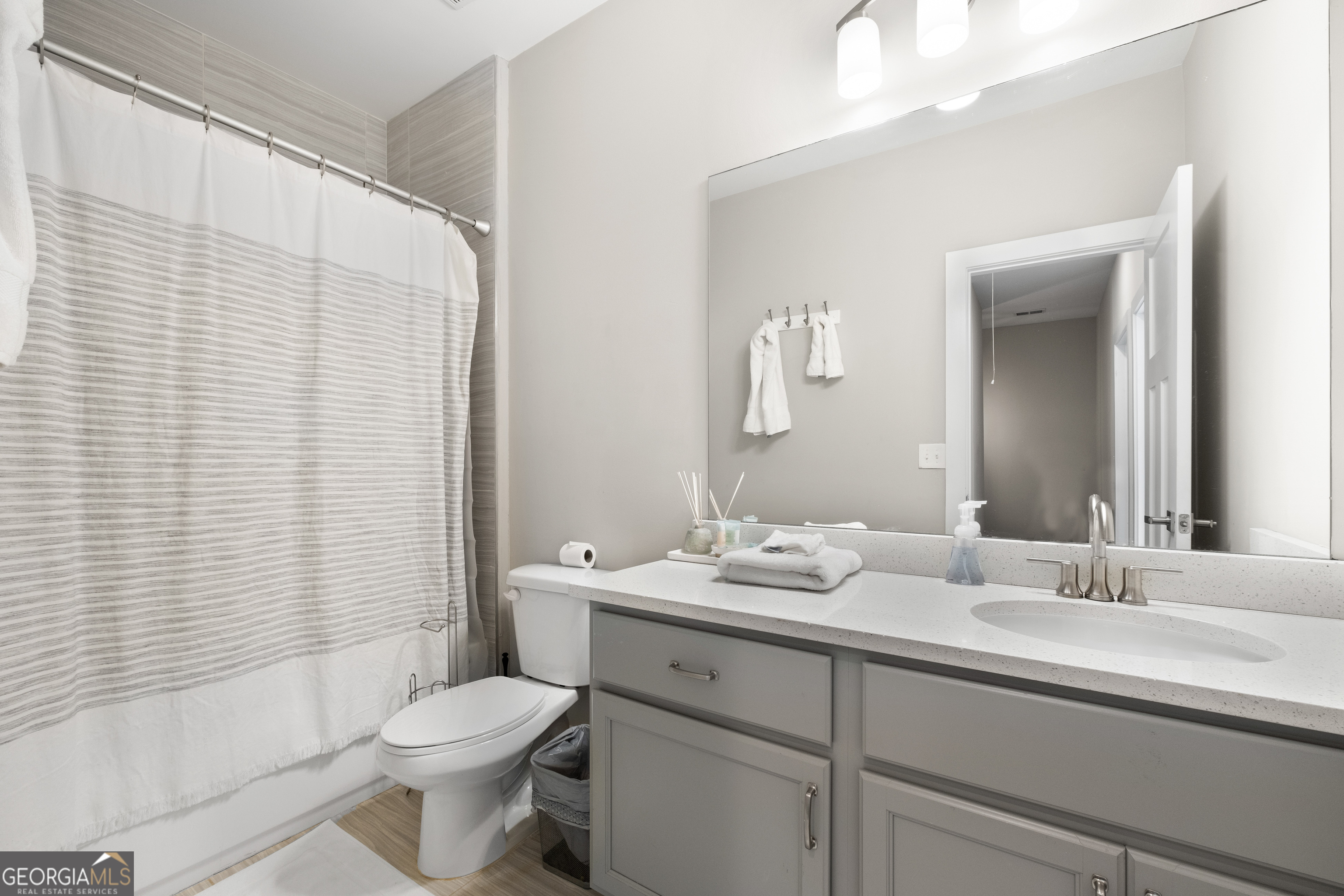3775 Jack Vernon Circle Powder Springs, GA 30127 - Photo 22 of 33 a bathroom with a double vanity sink toilet and shower