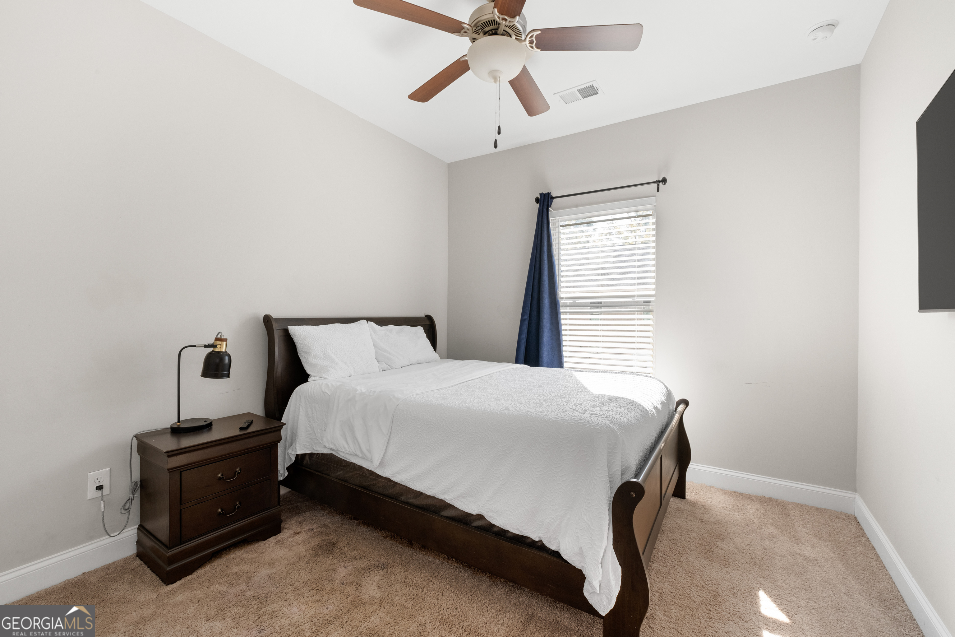 3775 Jack Vernon Circle Powder Springs, GA 30127 - Photo 23 of 33 a bedroom with a bed and window