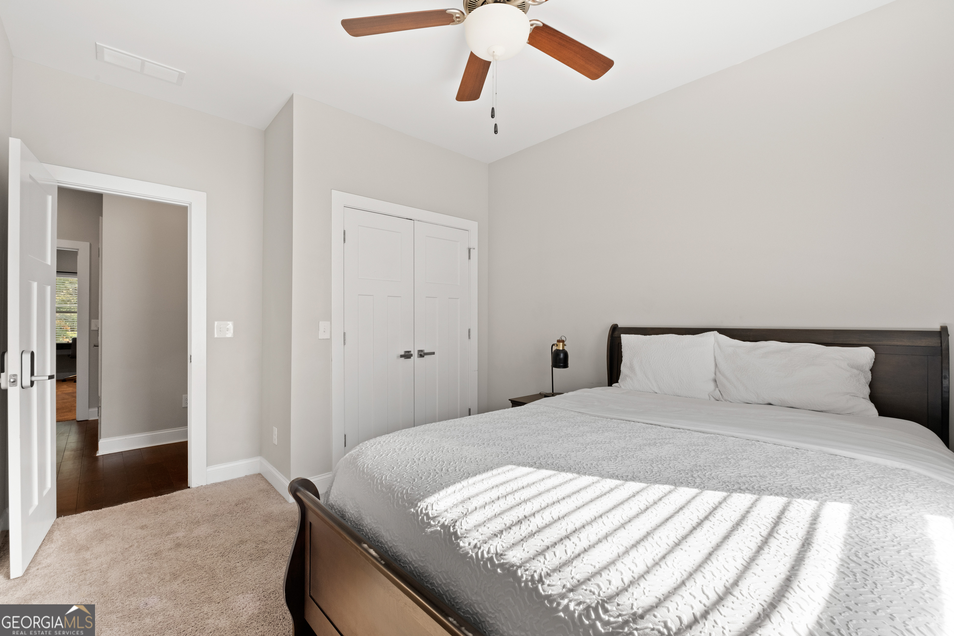 3775 Jack Vernon Circle Powder Springs, GA 30127 - Photo 24 of 33 a bedroom with a bed and wooden floor