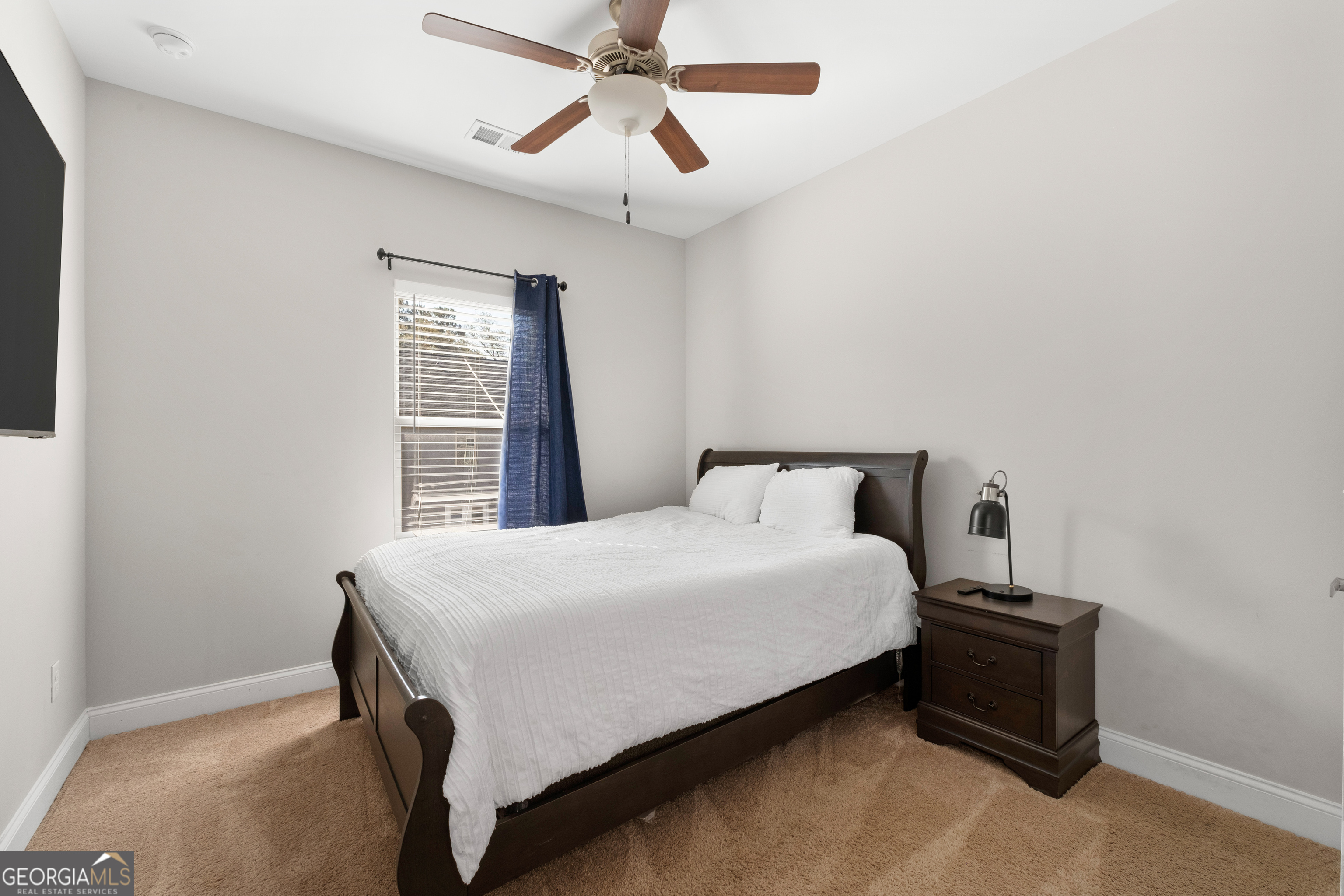 3775 Jack Vernon Circle Powder Springs, GA 30127 - Photo 25 of 33 a bedroom with a bed and window