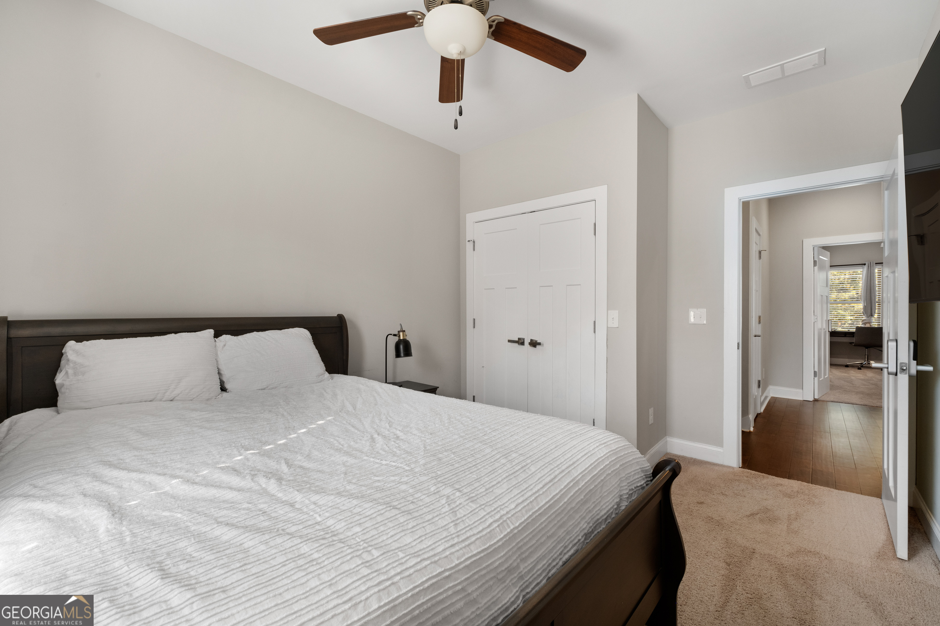 3775 Jack Vernon Circle Powder Springs, GA 30127 - Photo 26 of 33 a bedroom with a large bed and chandelier