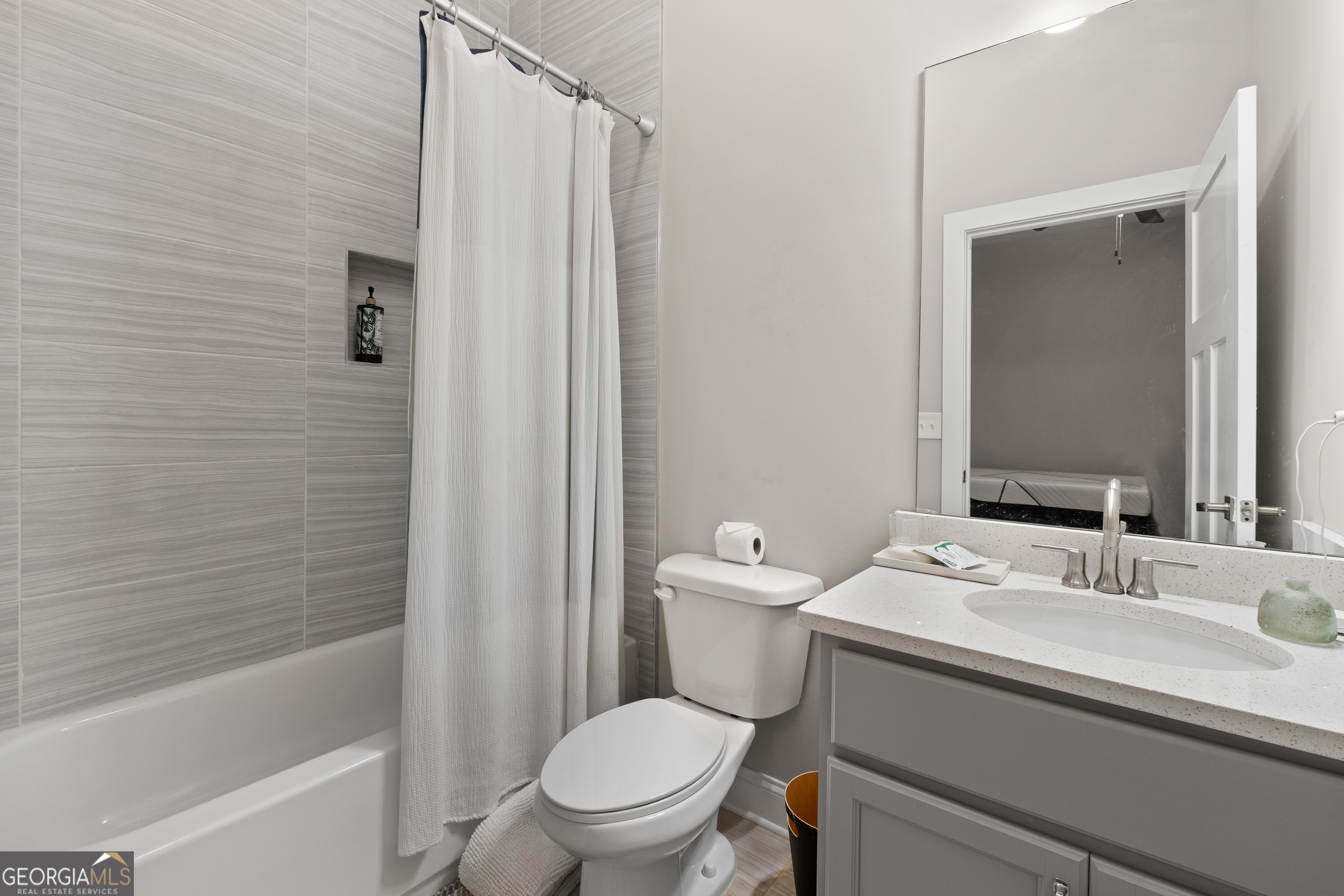 3775 Jack Vernon Circle Powder Springs, GA 30127 - Photo 29 of 33 a bathroom with a sink a toilet a mirror and shower