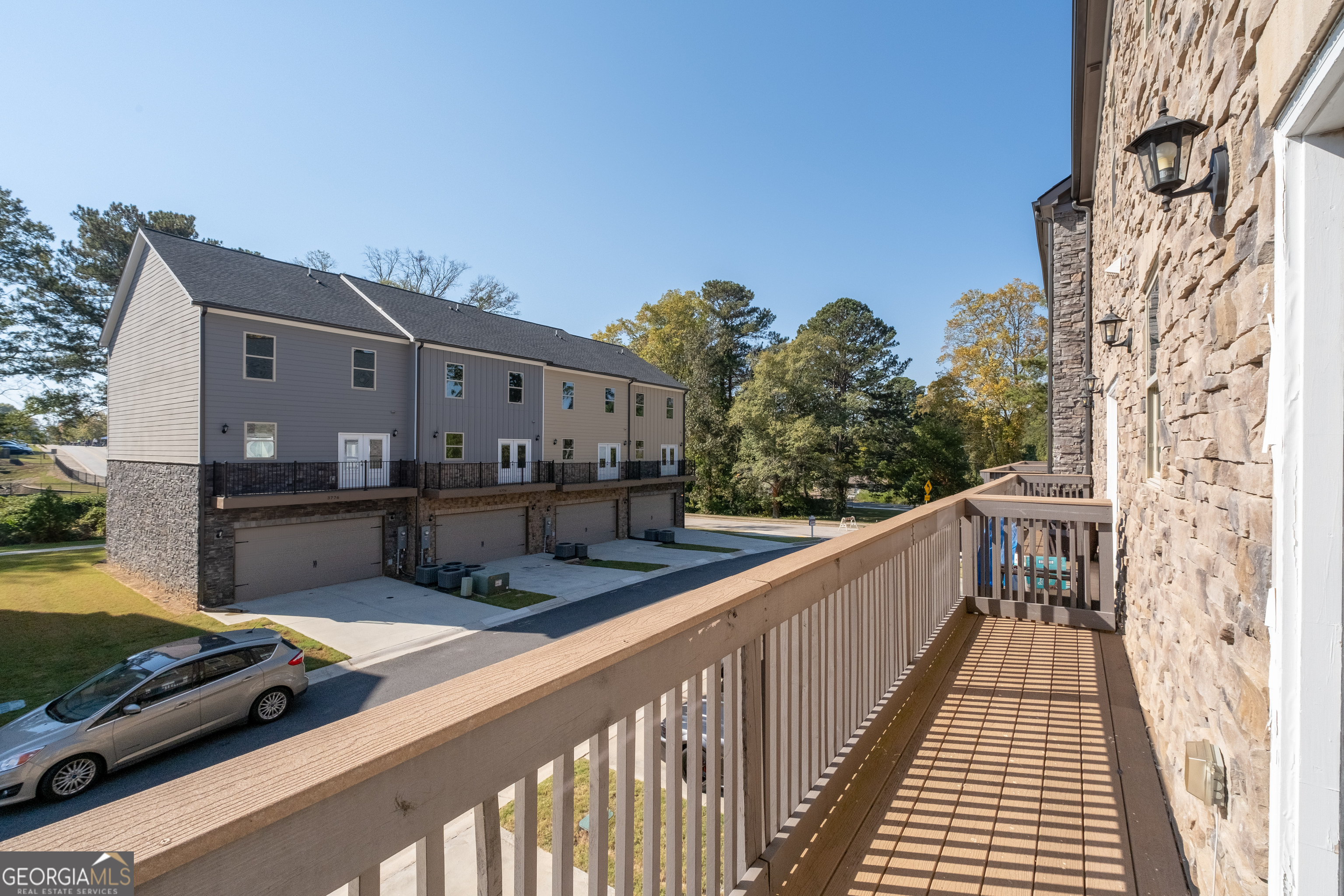 3775 Jack Vernon Circle Powder Springs, GA 30127 - Photo 31 of 33 a view of a balcony with wooden floor
