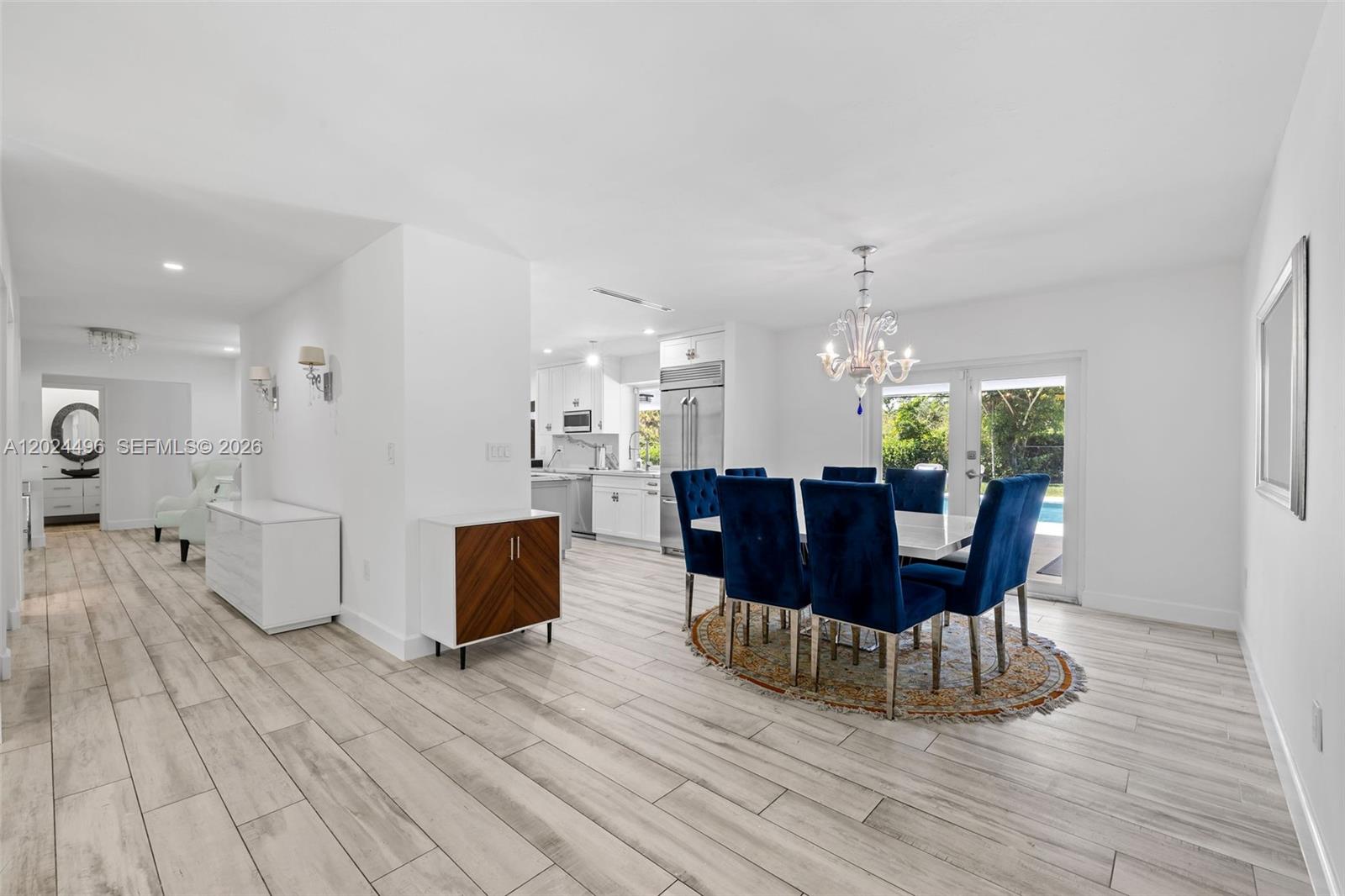 6875 North Cartee Road Palmetto Bay, FL 33158 - Photo 8 of 42 a view of a dining room with furniture and wooden floor