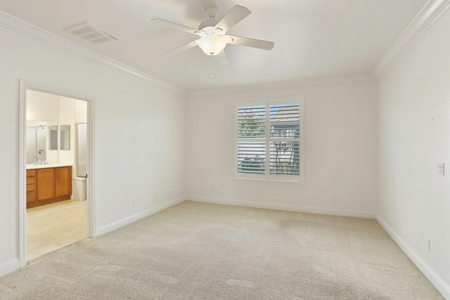 1709 Fox Trot Way Manteca, CA 95336 - Photo 13 of 24 an empty room with a window and a ceiling fan