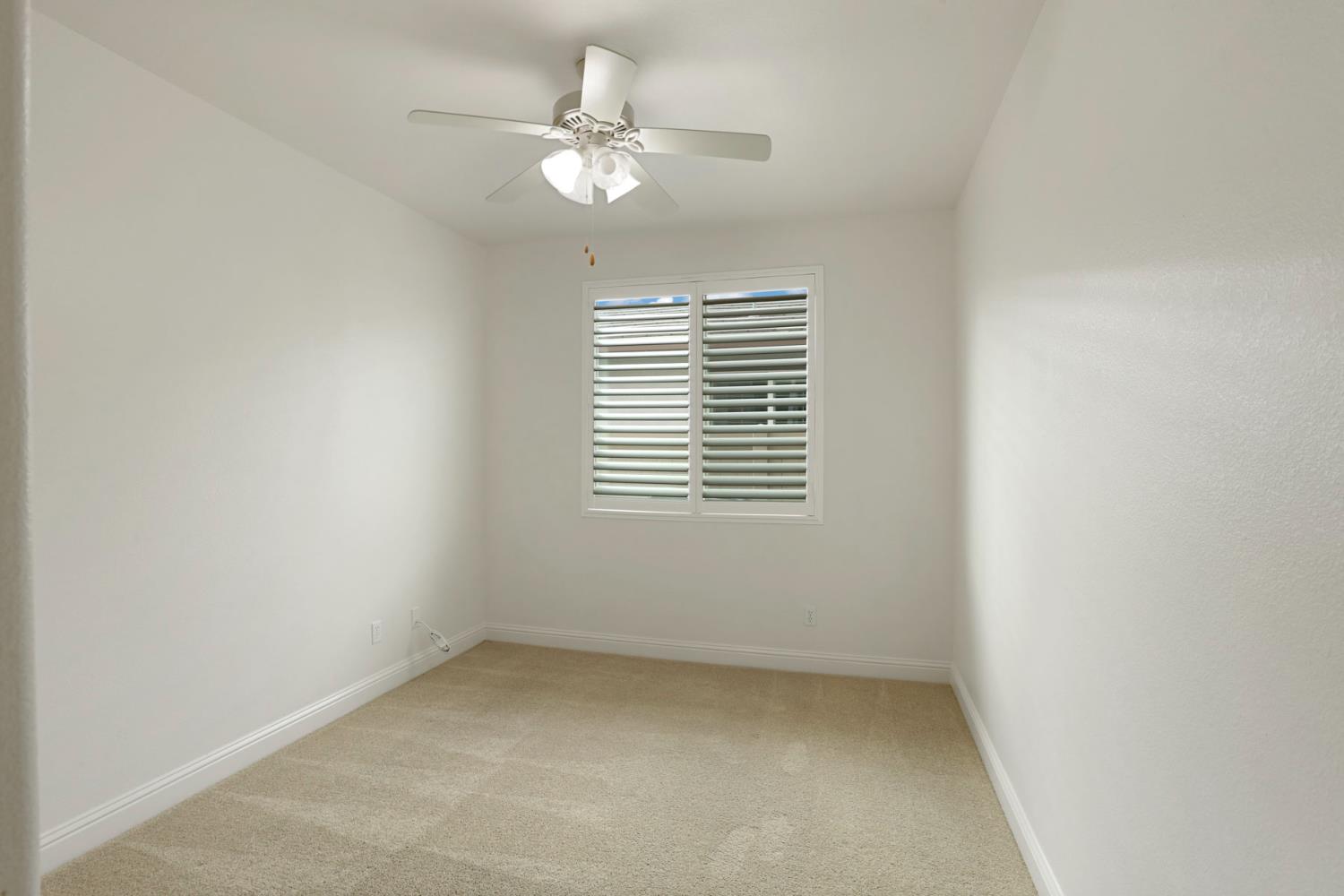 1709 Fox Trot Way Manteca, CA 95336 - Photo 9 of 24 an empty room with a window