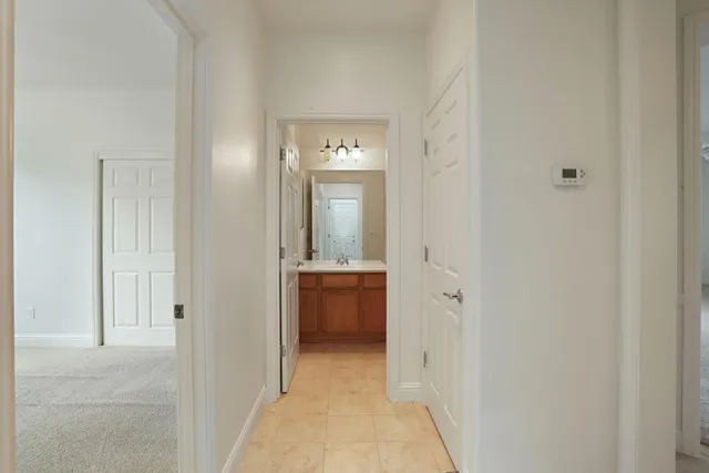 a bathroom with a granite countertop window