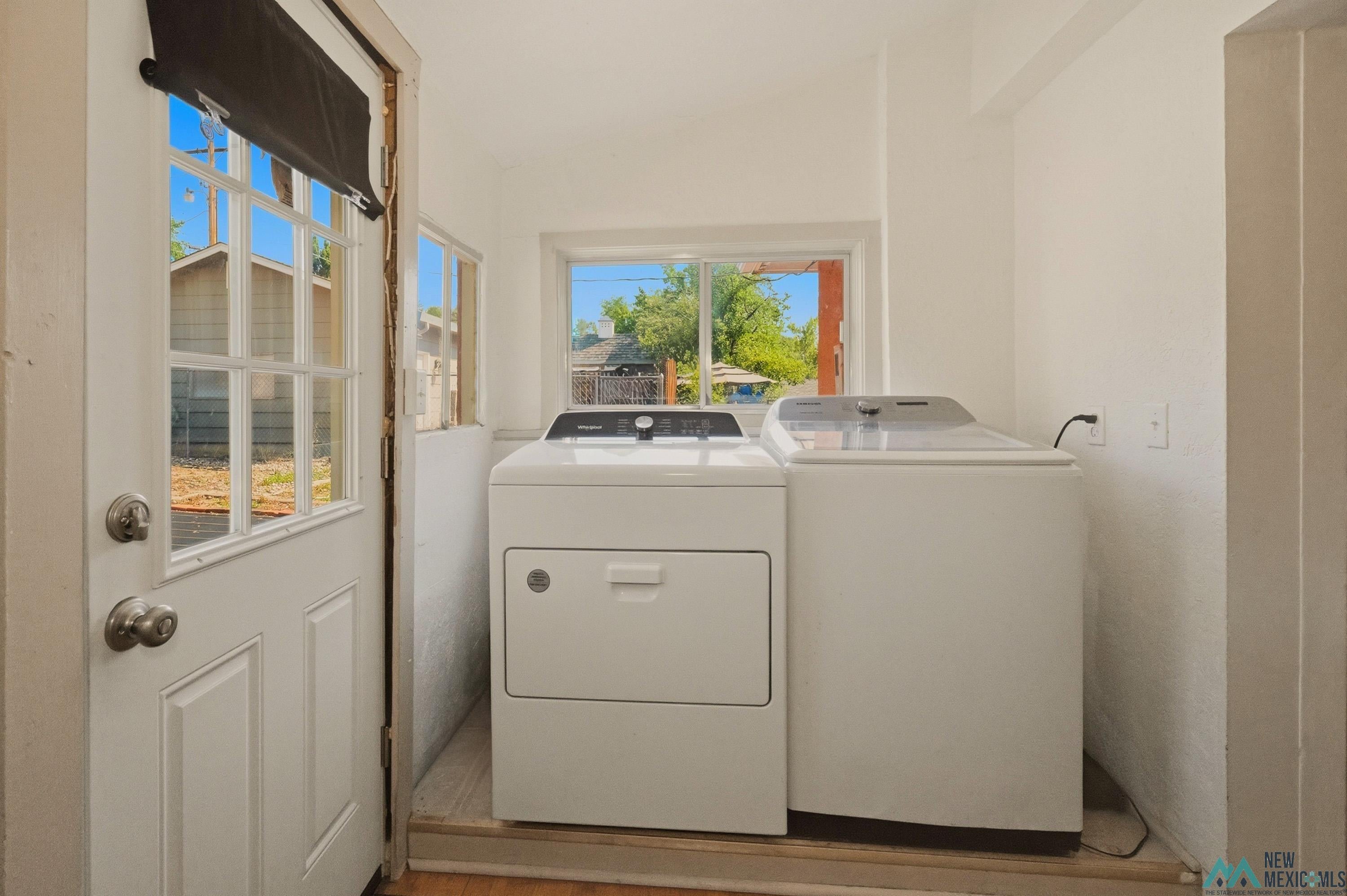 1026 South 5th Street Raton, NM 87740 - Photo 17 of 33 Dedicated laundry area featuring a white top-load washing machine and front-load dryer