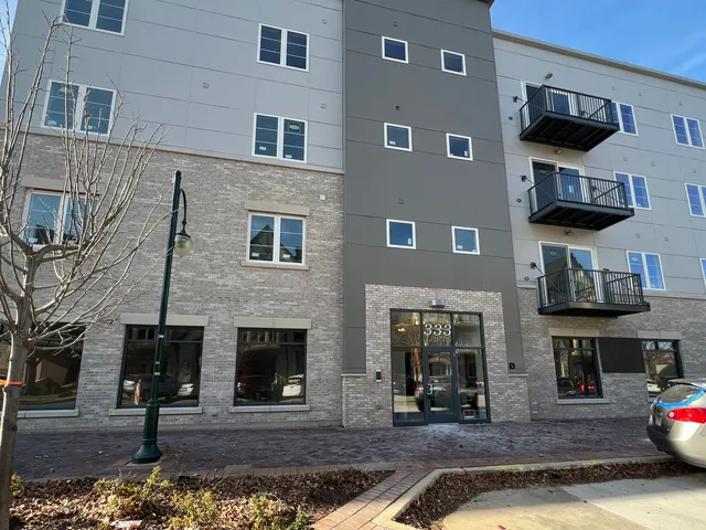 a front view of a house with barbeque area