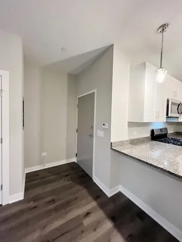 a view of a kitchen cabinets a sink and dishwasher in a kitchen