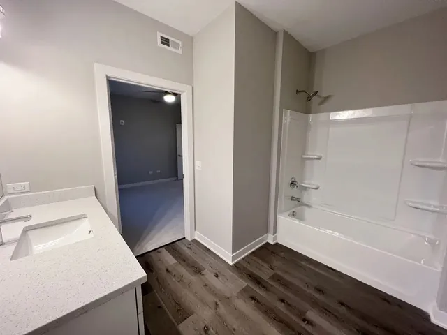 a bathroom with a sink and a shower