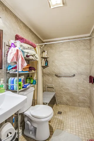 a bed room with a bed and a mirror