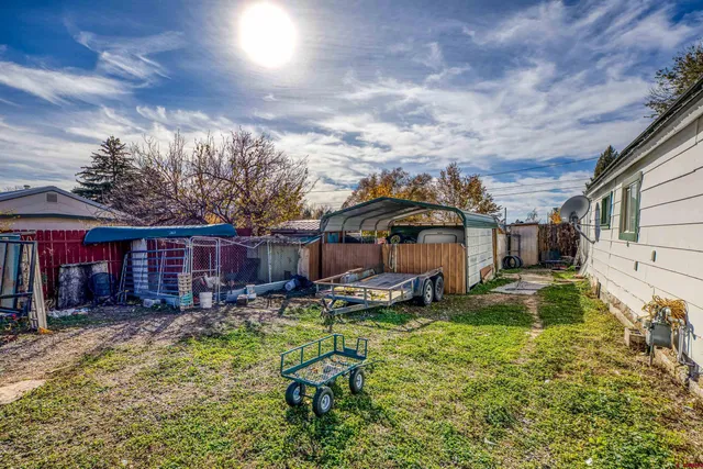 a swimming pool view with a outdoor seating