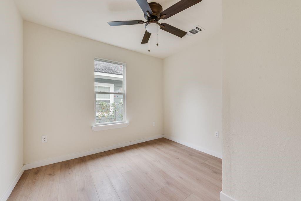 3414 Vilbig Road Dallas, TX 75212 - Photo 11 of 27 an empty room with a window and a fan