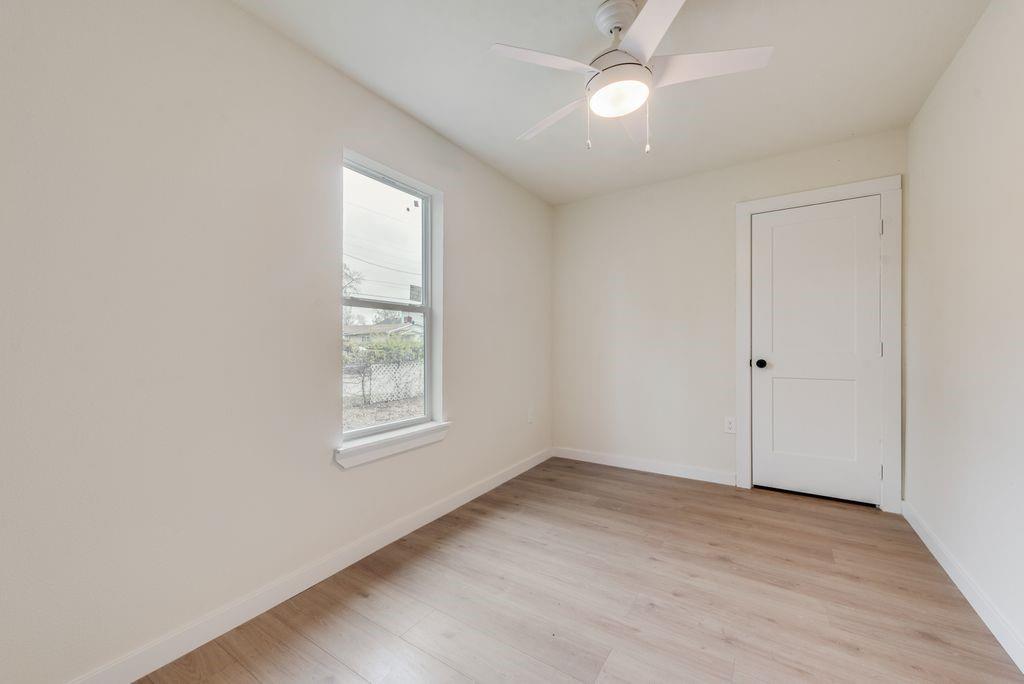 3414 Vilbig Road Dallas, TX 75212 - Photo 16 of 27 wooden floor in an empty room with a window