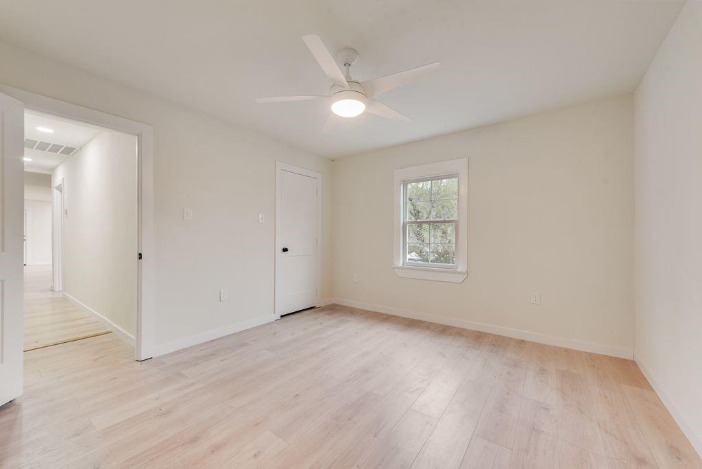 3414 Vilbig Road Dallas, TX 75212 - Photo 21 of 27 an empty room with wooden floor and windows