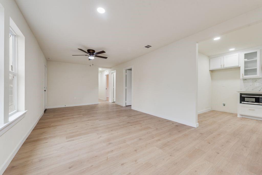 3414 Vilbig Road Dallas, TX 75212 - Photo 6 of 27 a view of a livingroom with a ceiling fan and window